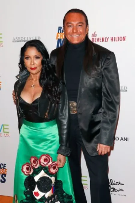 nick chavez with wife alima during an event.