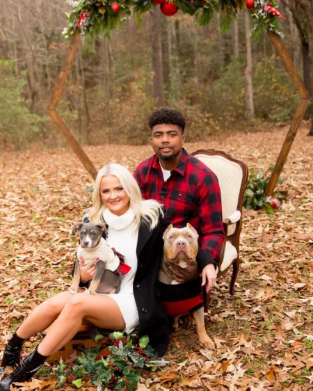 shelby pearlman with her husband and pet dogs